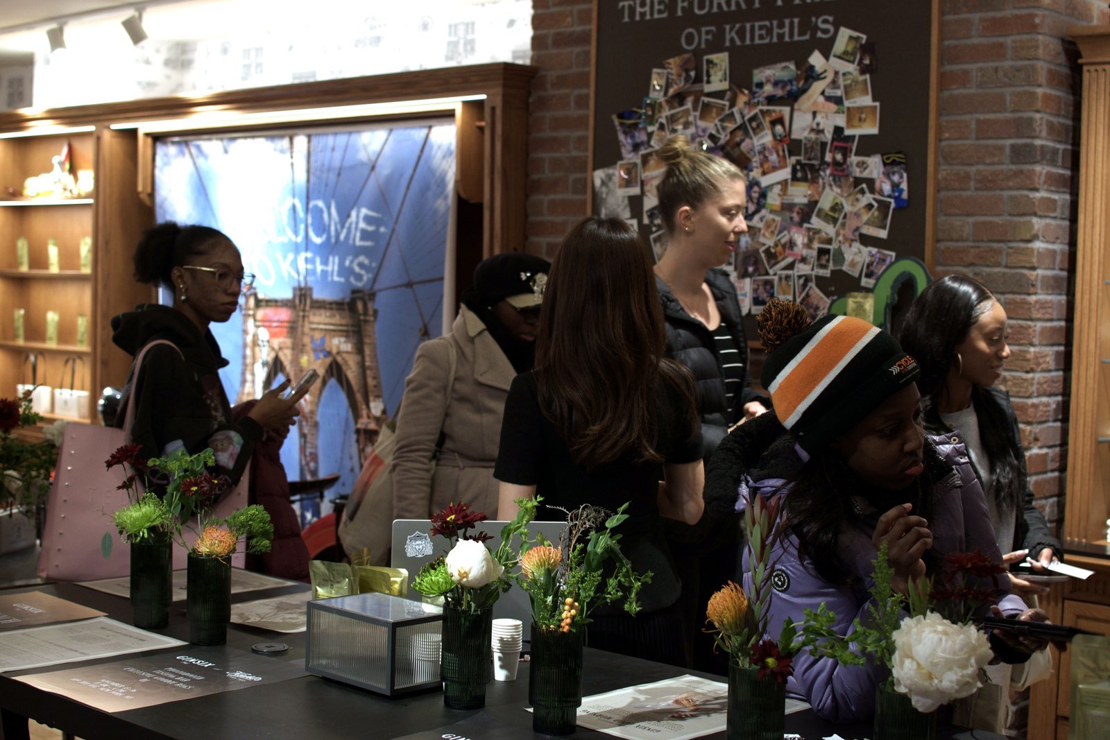 Guests engaging with GINSIX at the branded activation table